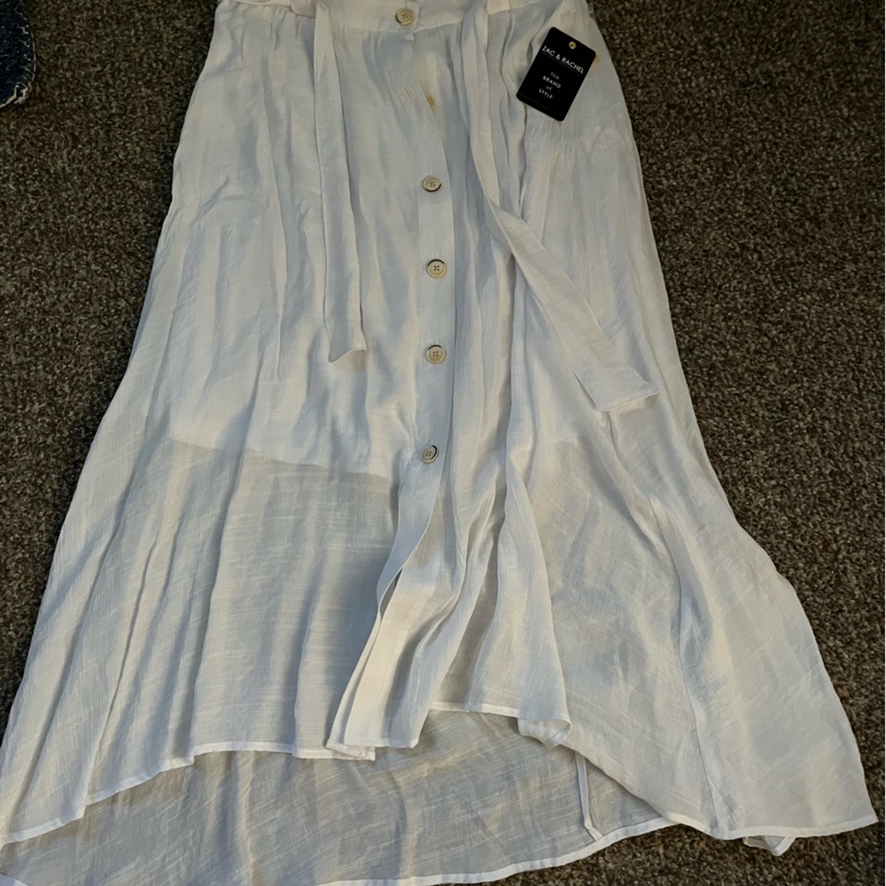 White polyester/rayon skirt. Size medium. Never worn tags still on